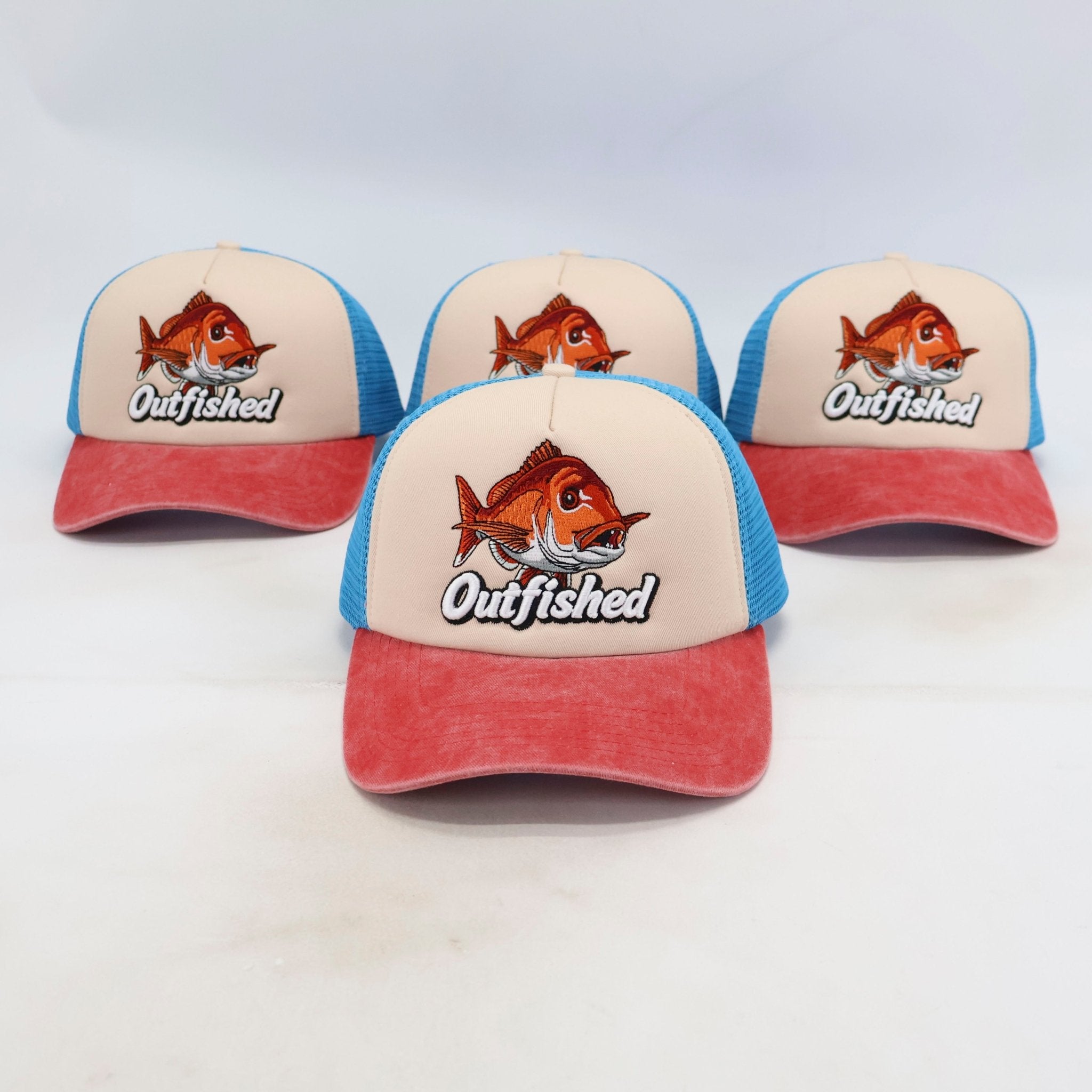 Four Knobby snapper fishing trucker caps – front view