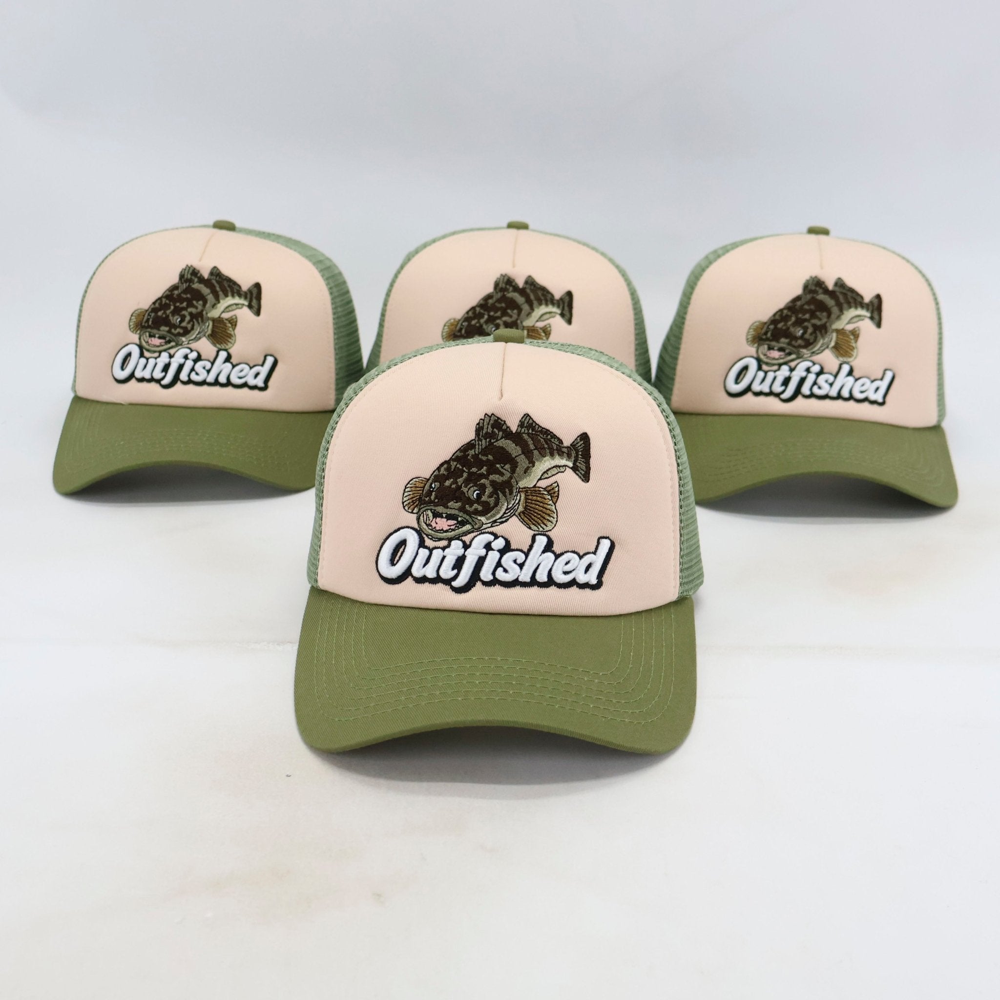 Four Lizard flathead fishing trucker caps lined up – front view