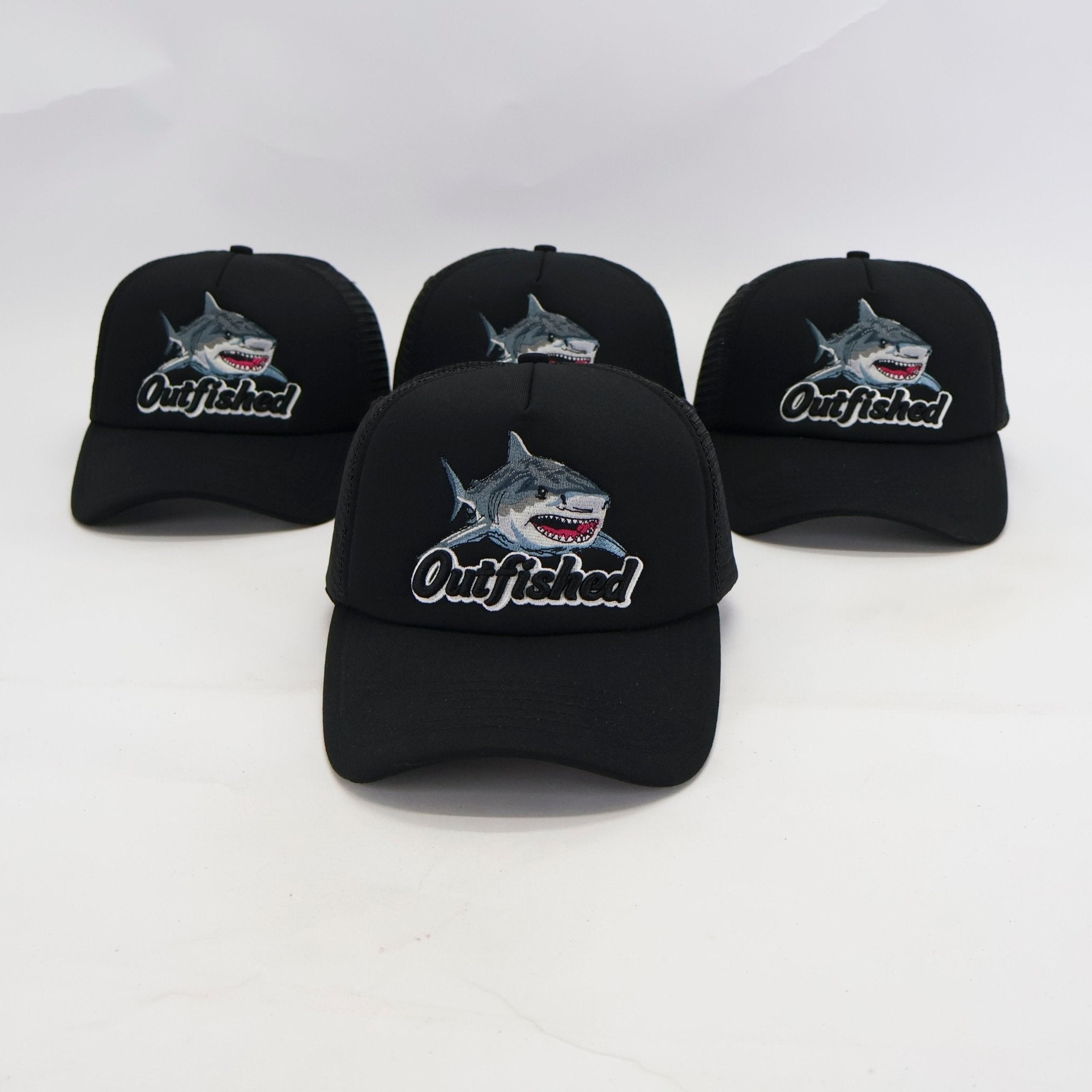 Three Noah bull shark fishing trucker caps with embroidered shark artwork